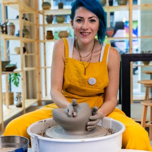 Sirin AlMasri, Ceramic artist, destroying a vase after throwing on the pottery wheel at Zolta Ceramics Studio Vienna