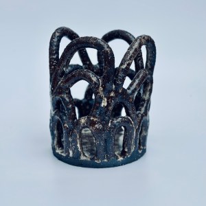 Handbuilt ceramic vessel by artist Sirin AlMasri, featuring an open lattice structure of interwoven arches in dark, sand-textured stoneware with a transparent glaze finish. Inspired by Middle Eastern architectural forms.