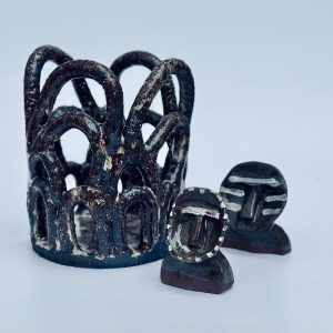 Handbuilt ceramic vessel by artist Sirin AlMasri, featuring an open lattice structure of interwoven arches in dark, sand-textured stoneware with a transparent glaze finish. Inspired by Middle Eastern architectural forms.